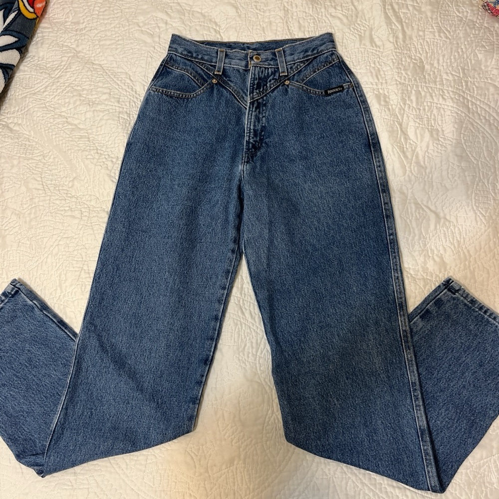 Like new blue pair of Rockies. Would best fit a size 25-26 waist.